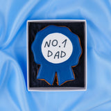 Hand-iced No.1 Dad rosette biscuit in gift box, overhead shot