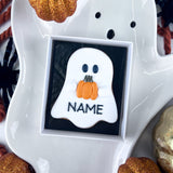 Personalised Ghost Iced Biscuit Holding A Pumpkin
