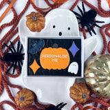 Halloween-themed biscuit gift box with a personalised Halloween biscuit centre piece.