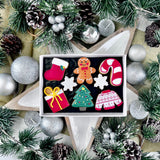 Mini Christmas Iced Biscuit Collection featuring a mini stocking, snowflake, candy cane, Christmas tree, festive jumper and gingerbread man.